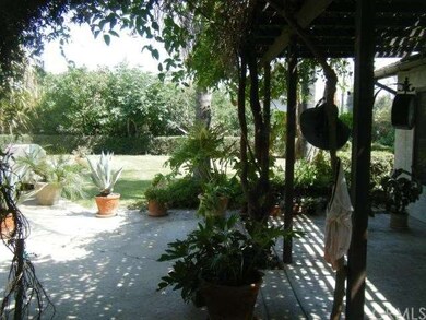 Covered patio and lush landscape