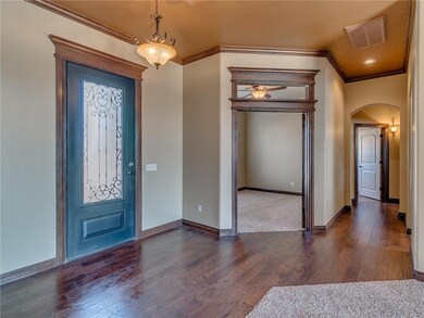 Large entry with beautiful hard wood floors. Heavy