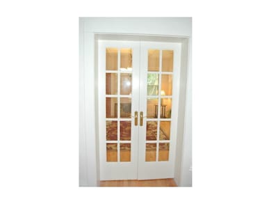French doors between living room and dining room.