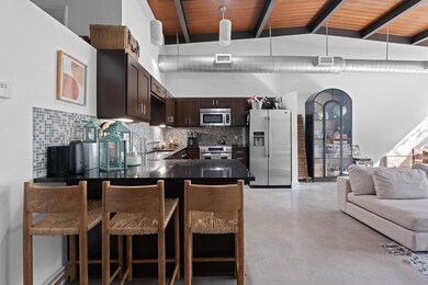 Kitchen with a peninsula, dark brown cabinets, ap