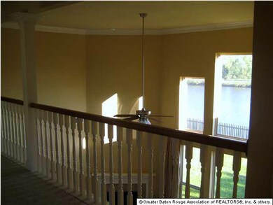View of balcony and large windows in family living