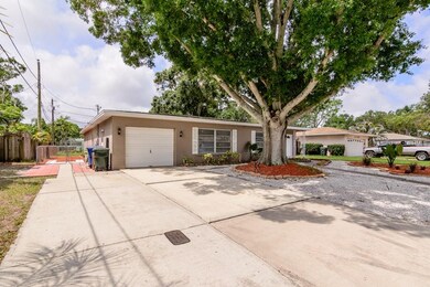 Oversized Driveway + Side Yard Parking Pad Creates