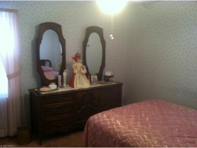First floor master bedroom with his and her closet