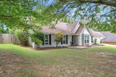 Ranch-style home featuring a front yard