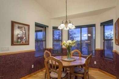 Breakfast Rm/Nook with drama Bay Windows