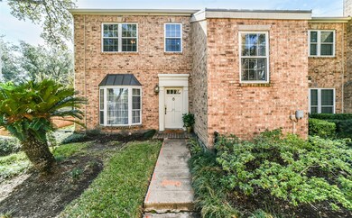 This lovely home is a corner unit at the end of a
