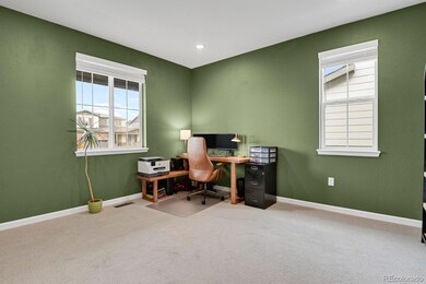 Office at front entry with french doors