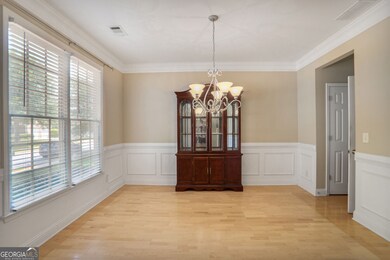 Upon entry, a separate dining room is located to the left, offering a dedicated space for meals and gatherings