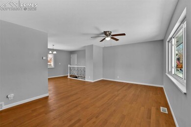 Living/great room with natural wood flooring, ceil