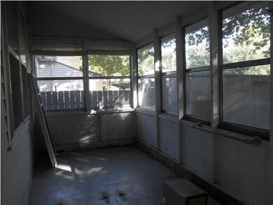 Entry to cellar is door in porch floor.