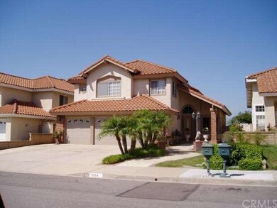 Lush landscaping and beautiful custom walkway with