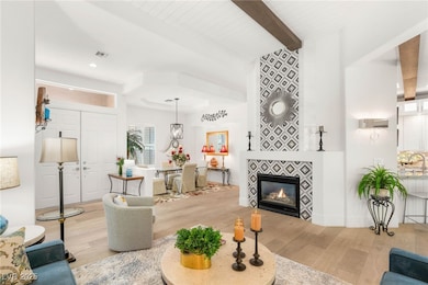 Living area featuring light wood-style flooring, b