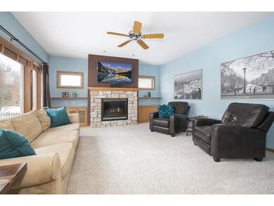 Main floor family room boasts a stone surround gas