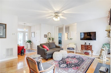 Alternate view of living room facing foyer and bedrooms.