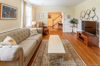 The large living room has hardwood floors and wall space for your art and entertainment.