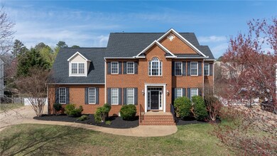 This stately brick-front transitional offers just