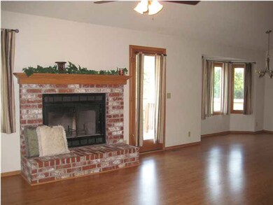 Cozy, wood-burning fireplace in living room