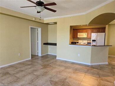 Kitchen featuring stove, light tile patterned floo