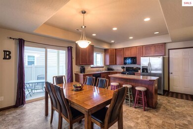 The open floor plan unites the kitchen, dining are