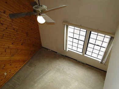 Upper level view of the living room. Notice the ce