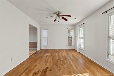 Living Room with oak hardwood floors and ceiling f