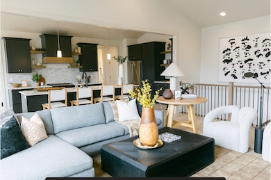 Living area featuring recessed lighting and light tile patterned floors