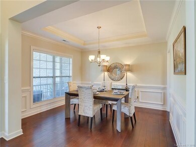 Dining room with tray ceiling, picture molding, ch