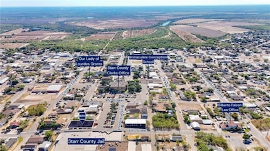 Aerial overview of property's location with nearby suburban area