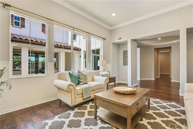 Formal living room looking into California Room, courtyard and into one of the main floor suites