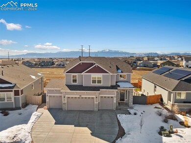 View of front of property featuring solar panels, 