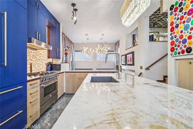 A true chefs kitchen with a massive quartz island