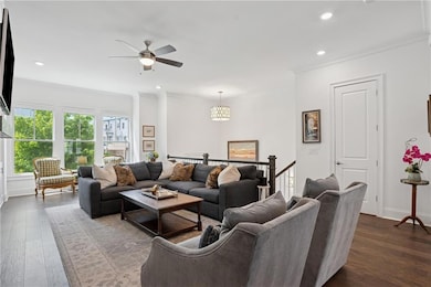 Living area featuring a ceiling fan, recessed ligh