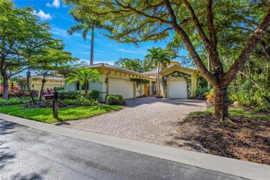 View of front of home with decorative driveway, an