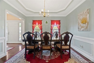 Dining space featuring a notable chandelier, a rai
