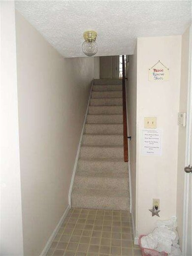 Entrance from front door and garage. Stairs lead t