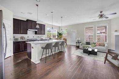 Kitchen with granite countertop.