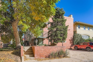 Front of building with current leaf cover