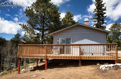 Back of property with a wooden deck