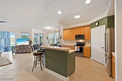 Kitchen with a tray ceiling, stainless steel appli