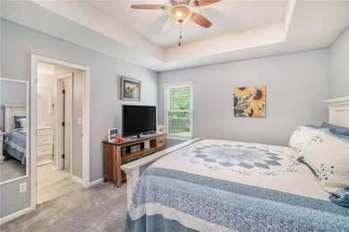 Additional view of primary bedroom, which opens to the private bathroom.