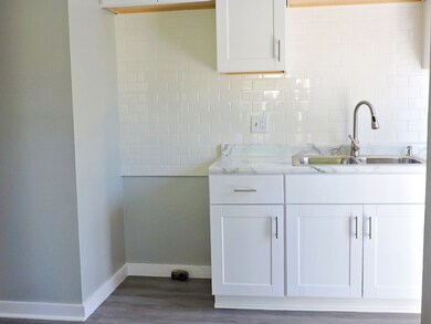 KITCHEN. VIEW OF WHERE STOVE AND MICROWAVE WILL BE INSTALLED
