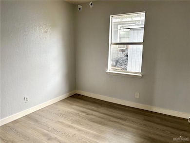 Unfurnished room featuring wood finished floors