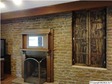 Stone Fireplace with Storage closet built in stone wall