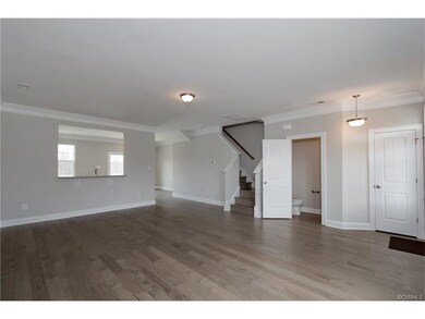 Family room.  Gray paint. Hardwood floors. Powder 