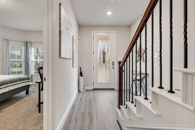 Beautiful entry way with light wood-type flooring