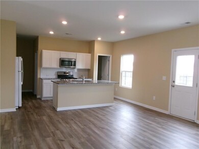 Kitchen with appliances with stainless steel finis