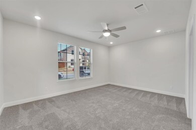 Unfurnished room featuring ceiling fan and carpet 