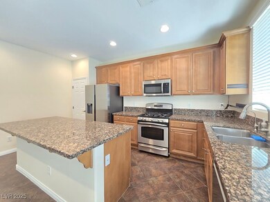 Kitchen with appliances with stainless steel finis