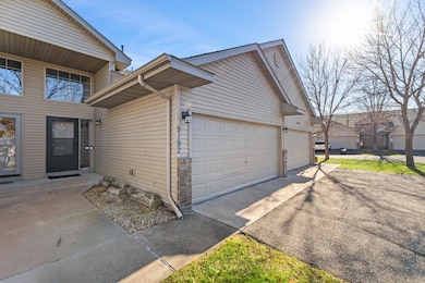 2-car attached garage and asphalt driveway.