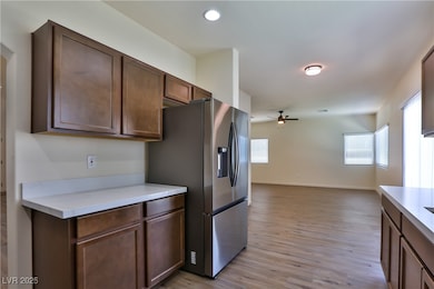 Kitchen with ceiling fan, stainless steel fridge,